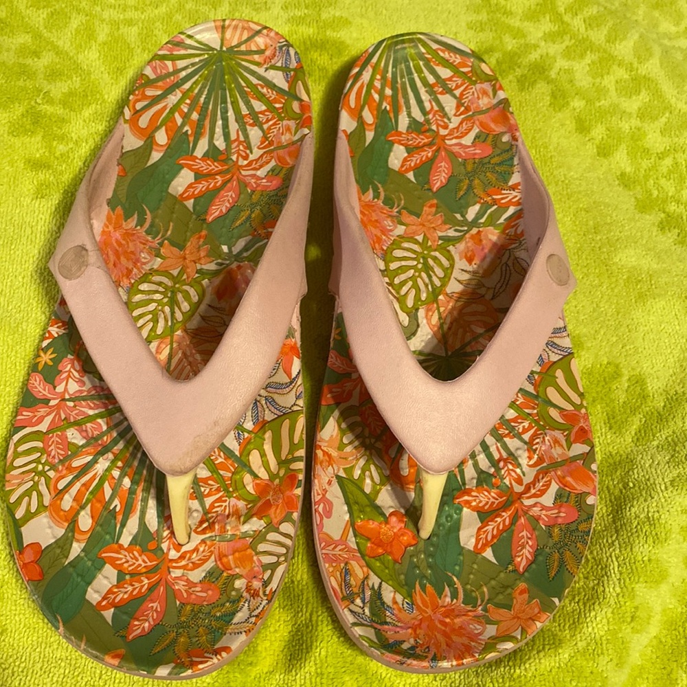 Crocs. Pink croc flip flops size W 8